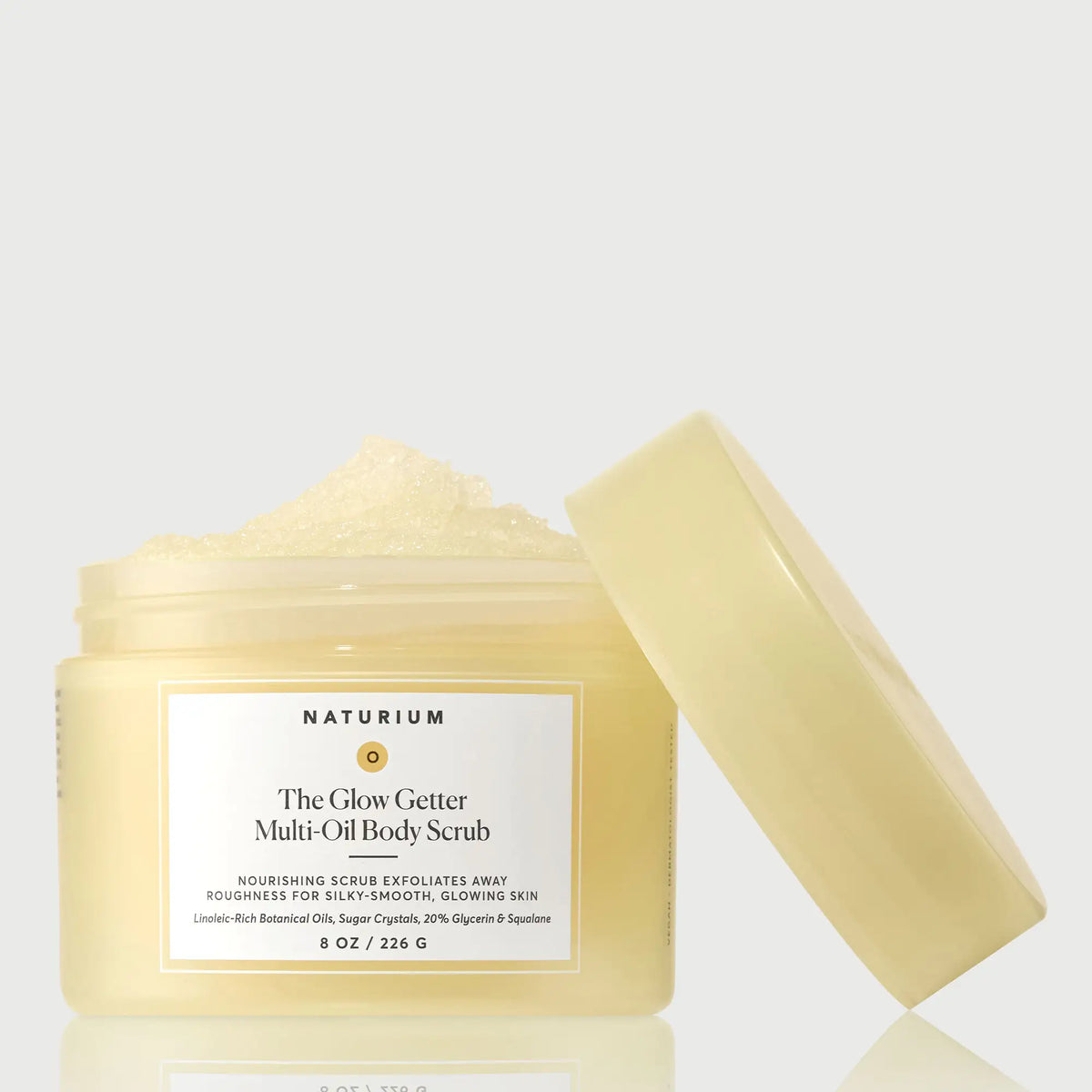 the-glow-getter-multi-oil-body-scrub-d6 NATR-40028-GlowGetter-Multi-Oil-Body-Scrub-Front-CapOff-bonebkgd.webp